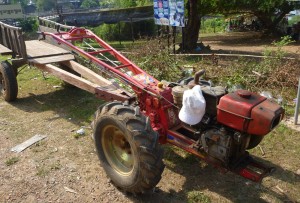 A typical Cambodia tractor. Features include hoodless design, allowing dust to more readily enter the engine, and extended steering column, decreasing turning radius.