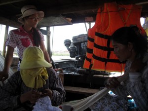 The rickety wooden ferry across the Mekong River leaves when it's full (about 10 people). Naturally, there are only two life jackets on board. I was carrying a large water bottle that Karen and I could have used for floatation, and we're good swimmers... the rest of you suckers are on your own!