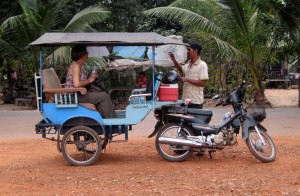 Karen chats with our tuk-tuk driver, Fickry, while waiting for Ken to finish photographing yet another temple
