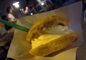 Halfway around the world, I found it: an exact duplicate (in terms of taste) of the famous Wisconsin State Fair creme puff, right down to the powdered sugar on top. It was as messy... and delicious... as the ones back home.