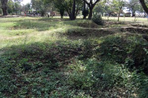 The Killing Fields. The depressions in the ground are areas where mass graves were excavated and bodies removed.